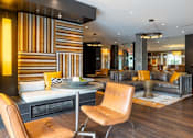 Thumbnail 27 of 84 - A modern living room with a striped wall and a fireplace at Mira Upper Rock, Maryland, 20850