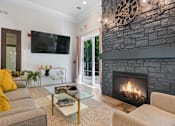 Thumbnail 16 of 24 - A living room with a flat screen TV at Poplar Glen Apartments, Columbia, MD, 21044.