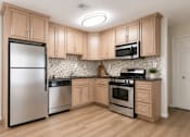 Thumbnail 1 of 22 - Elegant Kitchen at Potomac Ridge Apartments, Virginia, 22191