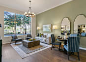 Thumbnail 1 of 24 - A living room with a sofa, chairs, and a coffee table at Prairie Crossing, Farmers Branch