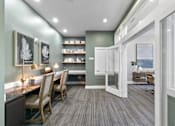 Thumbnail 10 of 24 - A room with a long table and chairs with a green wall and a white door at Prairie Crossing, Farmers Branch, TX