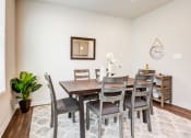 Thumbnail 14 of 30 - Dining Area with Table and Chairs at Refinery Row, Baltimore Maryland