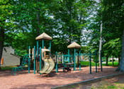 Thumbnail 52 of 54 - a playground with a slide in a park at Villages at Morgan Metro, Landover, MD