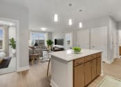 Thumbnail 5 of 35 - Kitchen And Living Room at Woodmore Apartments, Bowie, Maryland