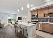Thumbnail 2 of 35 - Gourmet Kitchen With Island at Woodmore Apartments, Bowie, MD