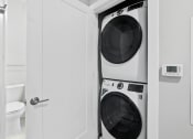 Thumbnail 14 of 35 - In Home Stacked Washer/Dryer at Woodmore Apartments, Maryland