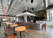Thumbnail 29 of 45 - a view of the bar and dining area from the front of the building at Aspire Apollo, Camp Springs