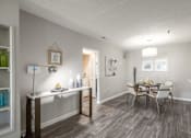 Thumbnail 10 of 46 - A dining room with a table set for four.