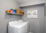 Thumbnail 36 of 81 - A laundry room with a sign that says "Help Apply Within".