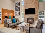 Thumbnail 32 of 54 - a living room with a fireplace and couches at Villages at Morgan Metro, Maryland, 20785