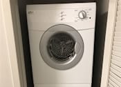 Thumbnail 6 of 10 - A white washing machine is stacked on top of another white washing machine.