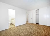 Thumbnail 35 of 47 - A room with carpeted floor and white walls.