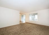 Thumbnail 26 of 47 - Empty room with carpeted floor and white walls.