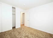 Thumbnail 25 of 47 - A room with a carpeted floor and white walls.