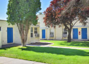 Thumbnail 5 of 48 - an exterior view of a building with blue doors
