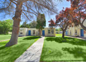 Thumbnail 14 of 48 - a sidewalk in front of a group of houses