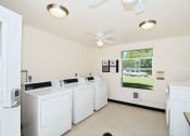Thumbnail 30 of 48 - the laundry room is equipped with washers and dryers