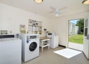 Thumbnail 31 of 48 - the laundry room is equipped with washes and dryers