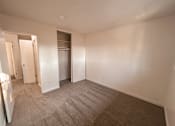 Thumbnail 40 of 47 - A room with carpeted flooring and white walls.