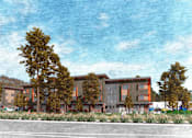 Thumbnail 6 of 9 - A building with orange and brown colors is surrounded by trees.