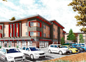 Thumbnail 8 of 9 - A row of cars are parked in front of a red and white building.