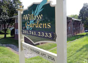 Thumbnail 9 of 16 - a sign in front of a building at Willow Gardens Apartments, New Jersey, 07666