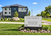Thumbnail 69 of 71 - A sign in front of a building that says "Vue Pointe Apartments".