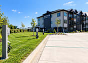 Thumbnail 62 of 71 - A parking lot in front of a building with a sign that says Vue Pointe.