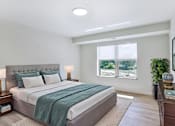 Thumbnail 3 of 4 - A bedroom with a large bed and a window overlooking a green area.