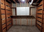 Thumbnail 15 of 15 - A room under construction with wooden beams and a white cabinet.