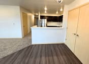 Thumbnail 7 of 34 - a kitchen and a living room in a empty apartment