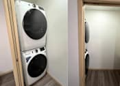 Thumbnail 22 of 34 - a washing machine and a dryer in a laundry room
