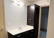 Thumbnail 21 of 34 - an empty bathroom with a sink and a shower
