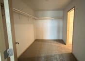 Thumbnail 19 of 34 - an empty room with a door to a closet
