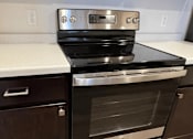 Thumbnail 10 of 34 - a kitchen with a stove and a counter top