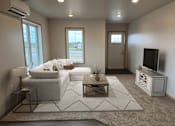 Thumbnail 3 of 34 - a living room with a couch and a television
