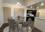 Thumbnail 5 of 34 - a dining room and kitchen with a table and chairs