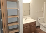 Thumbnail 10 of 19 - a bathroom with a toilet sink and mirror