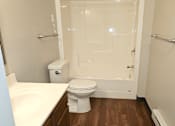 Thumbnail 11 of 19 - a bathroom with a toilet sink and shower