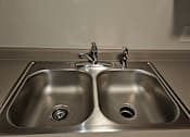 Thumbnail 4 of 19 - a kitchen sink with two faucets