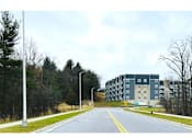 Thumbnail 23 of 24 - a large building on the side of a road
