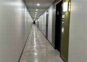 Thumbnail 27 of 29 - a view down a long corridor in an office building
