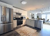 Thumbnail 4 of 29 - Kitchens feature Stainless Appliances and lots of Cupboards