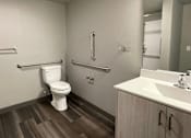 Thumbnail 23 of 29 - a bathroom with a toilet sink and mirror