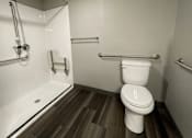 Thumbnail 24 of 29 - a bathroom with a toilet and a bathtub