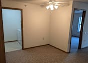 Thumbnail 13 of 37 - an empty room with a ceiling fan and a closet