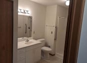 Thumbnail 18 of 37 - a bathroom with a sink toilet and a shower