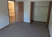 Thumbnail 14 of 37 - an empty room with a closet and an open door
