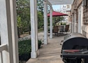 Thumbnail 32 of 37 - a barbecue grill on the front porch of a house