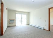 Thumbnail 5 of 37 - an empty living room with a door to a balcony
